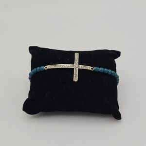teal beaded stretch bracelet with rhinestone cross charm